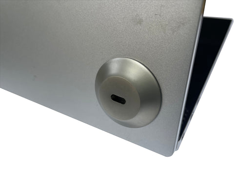 Adhesive laptop anchor on laptop